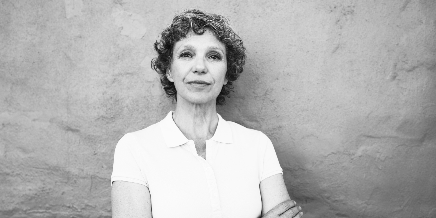 Stylized halftone image of a mountain peak with a beige sky